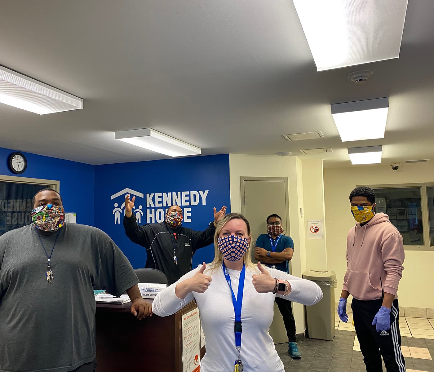 A group of people who work for Kennedy House in their head office